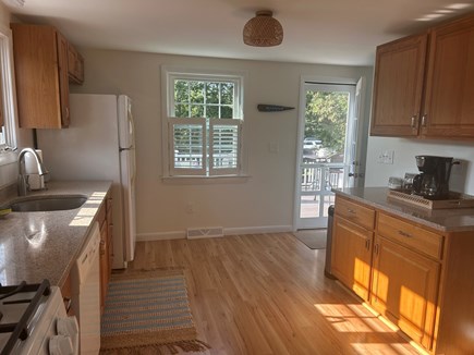 Harwich Cape Cod vacation rental - Full kitchen with walk out to deck. Steps to deck and access.