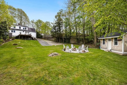 Falmouth Cape Cod vacation rental - Firepit in backyard