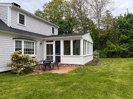 Barnstable Cape Cod vacation rental - Backyard with patio set