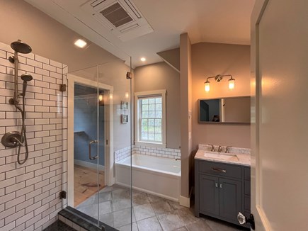 Barnstable Cape Cod vacation rental - Primary bathroom with shower and tub. Walk-in closet