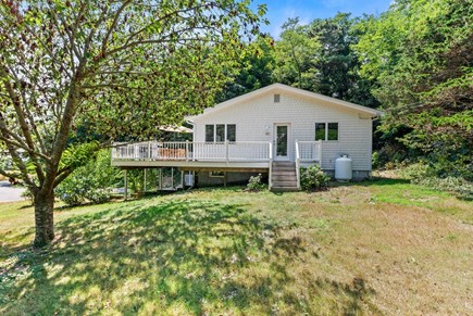 Wellfleet Cape Cod vacation rental - Side yard with access to kitchen, dining, and deck.