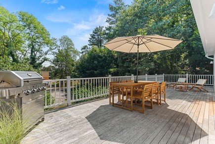 Wellfleet Cape Cod vacation rental - Massive wraparound deck with grille, outdoor dining and loungers.