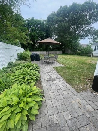 Yarmouth Cape Cod vacation rental - Patio w/gas Grill, fire pit, yard