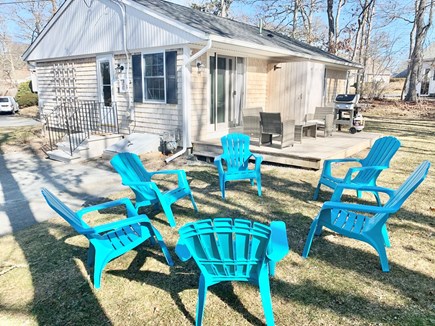 Centerville Cape Cod vacation rental - Backyard with deck and grill and outdoor shower (seasonal)