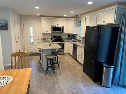 Truro Cape Cod vacation rental - Kitchen and side door to porch and driveway