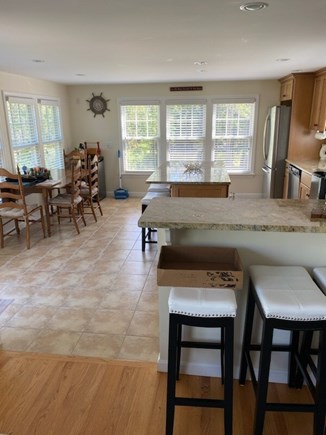 East Dennis Cape Cod vacation rental - Kitchen - counter bar, island w/ bar stools, table, Mini frig.