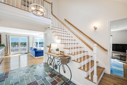 East Orleans Cape Cod vacation rental - Open Front Hall Staircase and TV Room.