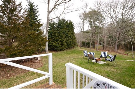 Pocasset Cape Cod vacation rental - Backyard<br/>(New decking,seating,TV & fire table will be ready 2025)