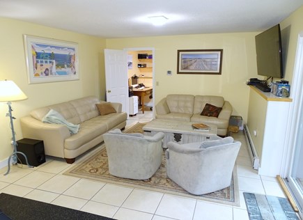 South Yarmouth Cape Cod vacation rental - Downstairs family room with TV, slider to back yard