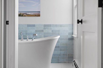 Falmouth Cape Cod vacation rental - 1st fl primary bath: water views, tub, tiled shower, heated floor