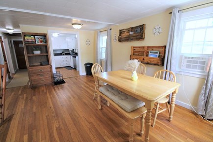 Hyannis Cape Cod vacation rental - Dining room looking into the kitchen and down the hall