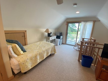 Eastham Cape Cod vacation rental - Twin bed and view out to balcony in apartment bedroom