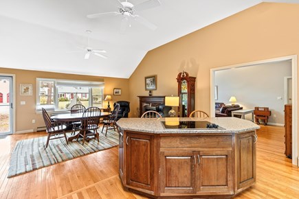 Eastham Cape Cod vacation rental - View from kitchen island into eating area and living room (right)