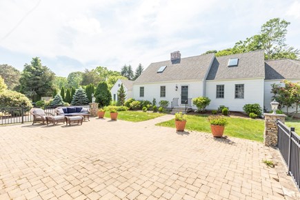 Falmouth Cape Cod vacation rental - Front Patio area- great for yard games, fire pit and basketball