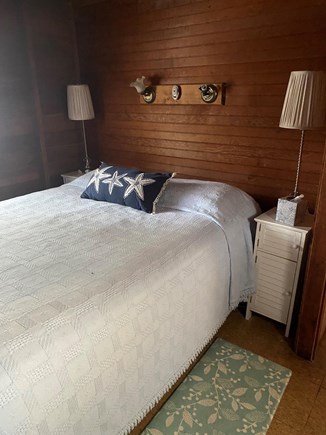 Wellfleet Cape Cod vacation rental - The queen size bed has two windows and a door to the outside.