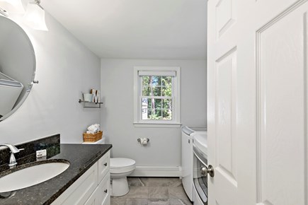 Mashpee Cape Cod vacation rental - Half bathroom with a washer located at the first floor