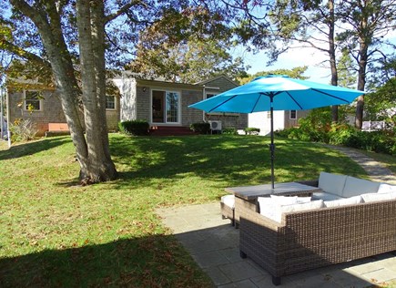 Yarmouth Cape Cod vacation rental - Patio with seating and gas grill 