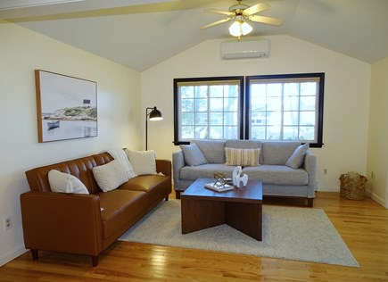 Yarmouth Cape Cod vacation rental - TV room with comfortable sectional, adjacent to dining room