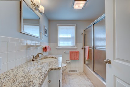 South Chatham Cape Cod vacation rental - First-floor bathroom with shower and tub.