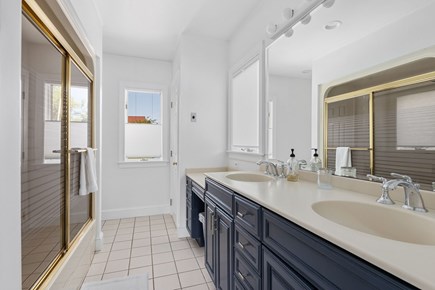 Eastham Cape Cod vacation rental - Full bathroom with a double vanity, tub, and shower