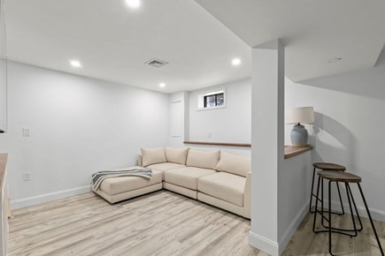 Falmouth Cape Cod vacation rental - TV Room sectional.  We are new!  Artwork coming!