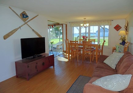 West Yarmouth Cape Cod vacation rental - Living room opens to dining area and water views