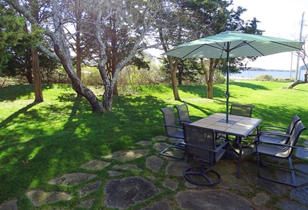 West Yarmouth Cape Cod vacation rental - Private side yard with patio, grill, water view 