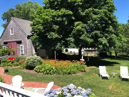 Brewster Cape Cod vacation rental - Large backyard with gardens, tree swing, hammock, lawn chairs.