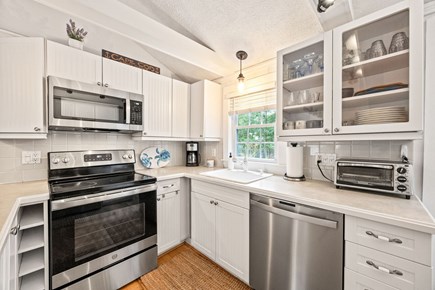 West Yarmouth Cape Cod vacation rental - Open kitchen with stove, dish washer, refrigerator, and microwave