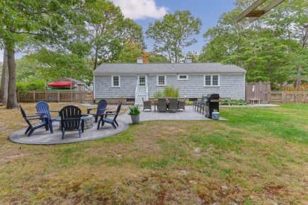 West Yarmouth Cape Cod vacation rental - Fenced in back yard with plenty of dining areas and fire pit