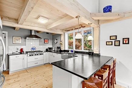 Mashpee Cape Cod vacation rental - A full kitchen with seating for three at the counter