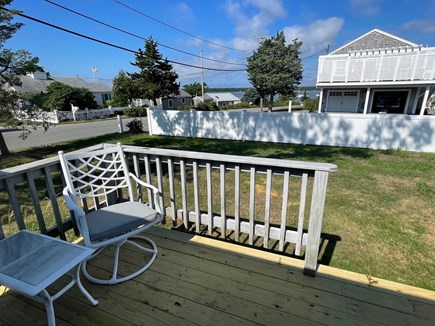 Mashpee Cape Cod vacation rental - Big deck over looking the water with dinning table and chairs.