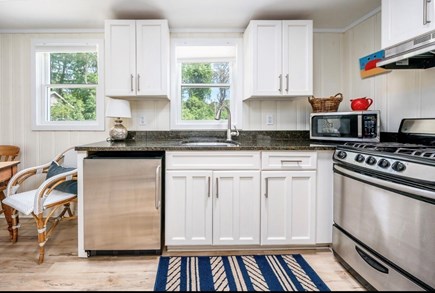 Truro Cape Cod vacation rental - Kitchen with fridge and sink and plenty of cooking essentials