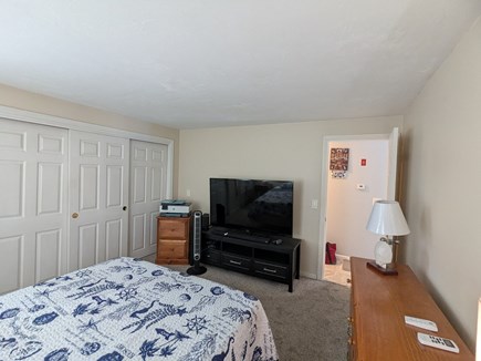 Dennis Cape Cod vacation rental - First floor bedroom with television across from bathroom
