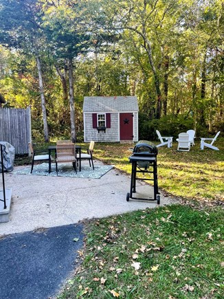 Dennis Cape Cod vacation rental - Outdoor dining space with gas grill and outdoor shower