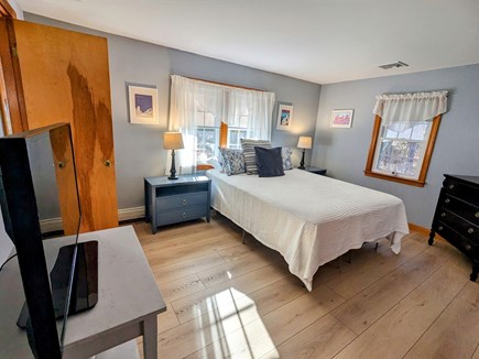 Dennis Cape Cod vacation rental - Primary bedroom with cable TV and private half bath