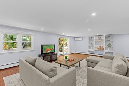 Falmouth Cape Cod vacation rental - Living room with direct access to the back deck as well