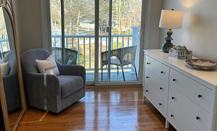 Popponesset Cape Cod vacation rental - Master bedroom sitting area with balcony.