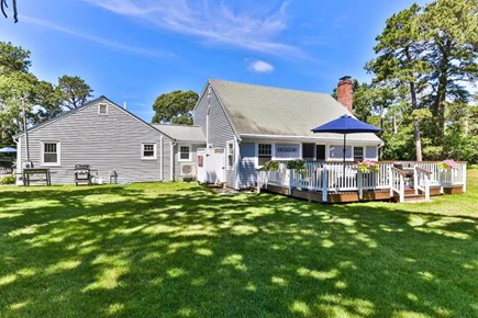 Dennis Cape Cod vacation rental - Back Deck overlooking beautiful grounds.<br/>Let the games begin...