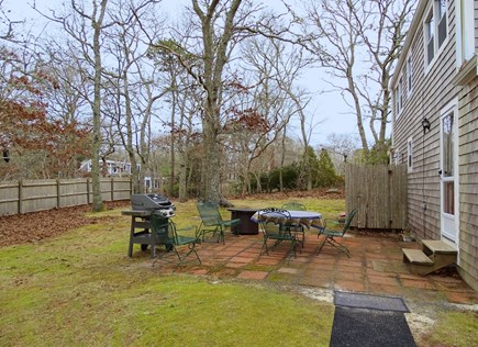 Brewster Cape Cod vacation rental - Back yard provides gas grill, dining area and outdoor shower 