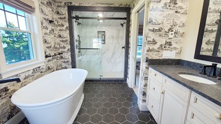 Eastham Cape Cod vacation rental - Second floor primary ensuite bathroom with separate tub &  shower