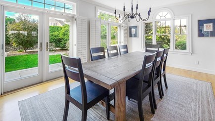 Eastham Cape Cod vacation rental - Dining area with doors to back deck and yard