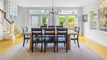 Eastham Cape Cod vacation rental - Dining area with doors to back deck and yard