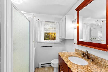 Brewster Cape Cod vacation rental - Bathroom with a stand up shower and washer / dryer