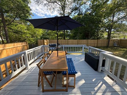 Yarmouth Cape Cod vacation rental - Back deck with gas grill, table and chairs.