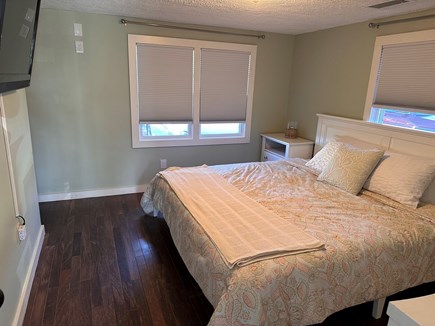 West Dennis Cape Cod vacation rental - Primary Bedroom - King bed, flatscreen tv and desk/vanity area