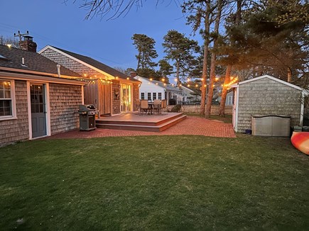 West Dennis Cape Cod vacation rental - Fully fenced in back yard. Outdoor shower, deck, bbq, and lights.