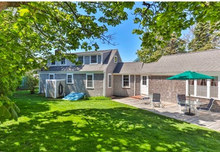 Chatham Cape Cod vacation rental - Backyard with deck, outdoor shower, outdoor dining and grill