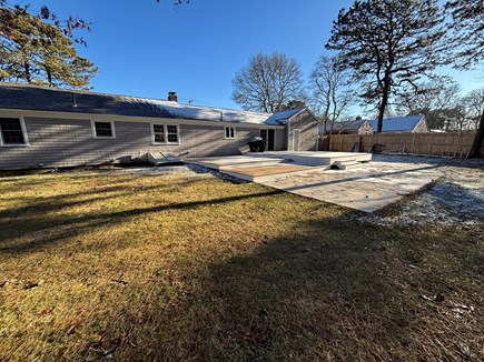 West Yarmouth Cape Cod vacation rental - New patio area. Adirondack chairs & wood fire pit in Spring 2025!