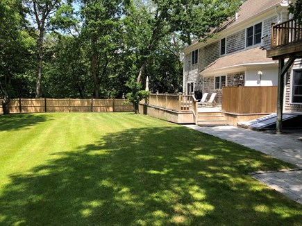 Yarmouthport Cape Cod vacation rental - Fenced in Backyard with deck , shower, grill and deck furniture